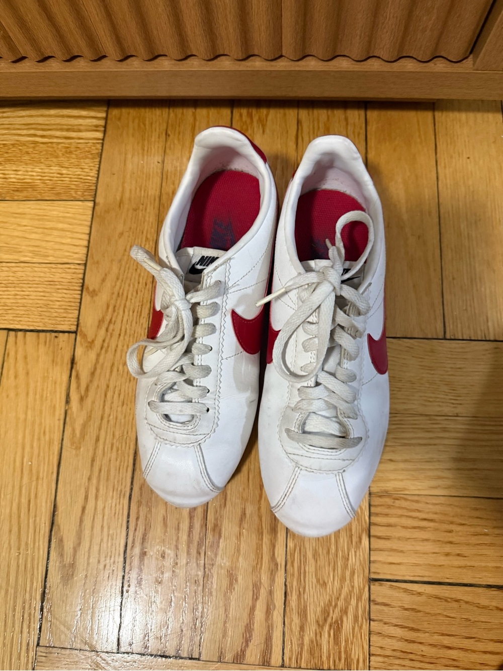Nike Women’s White Sneakers with Red Swoosh
